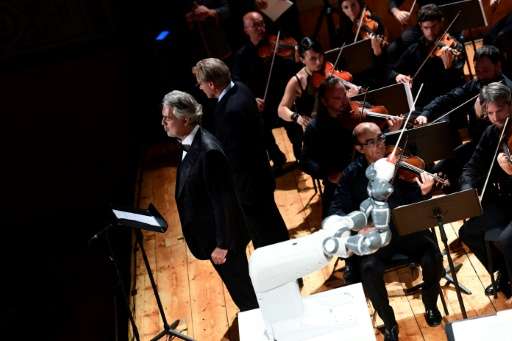 Italian tenor Andrea Bocelli performing alongside YuMi, which conducted three pieces of music
