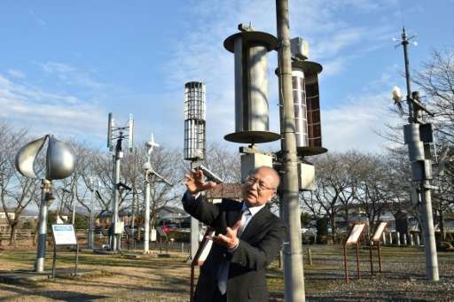 Izumi Ushiyama, a professor and expert of wind power at Ashikaga Institute of Technology, speaks at the natural energy square in