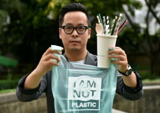 Kevin Kumala, founder of Avani Eco, shows his products during an interview in Jakarta