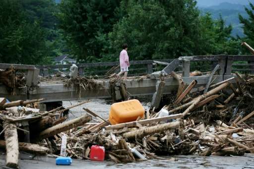 Kyushu has been left devastated after overflowing rivers and torrential downpours swept away roads, houses and schools