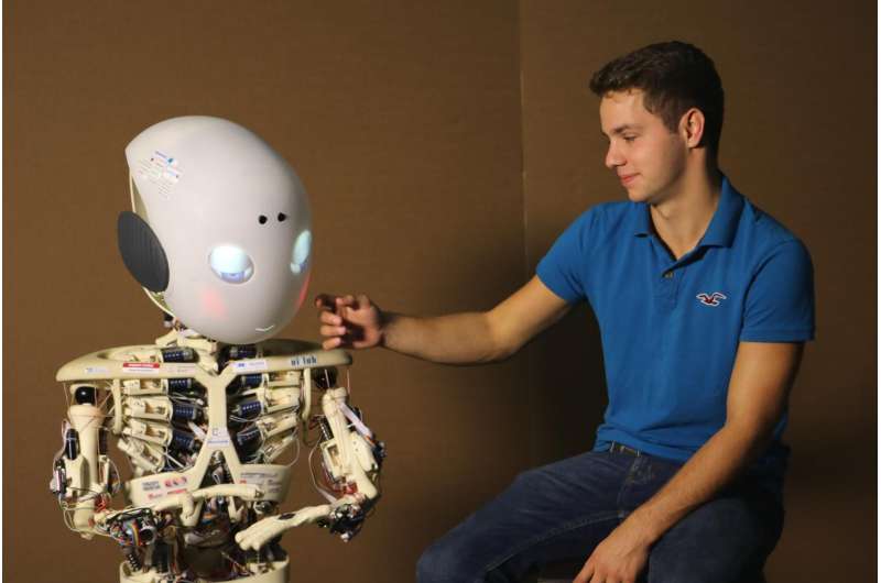 Live interactions with robots increase their perceived human likeness
