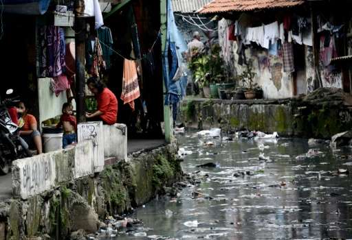 Narrow ducts that run from Jakarta's main waterways and through slums are often filled with rubbish due to the lack of a decent 