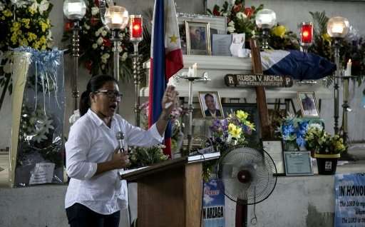 Nieves Rosento, mayor of the town of El Nido, Palawan island, the Philippines, speaks at the wake of murdered environmental para