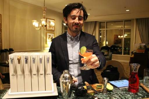 Opn manager Tristan Capelier demonstrates the Pernot Ricard-backed home &quot;mixology&quot; unit at the Consumer Electronics Sh