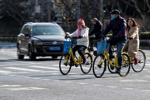 People ride Ofo-bicycles in Shanghai