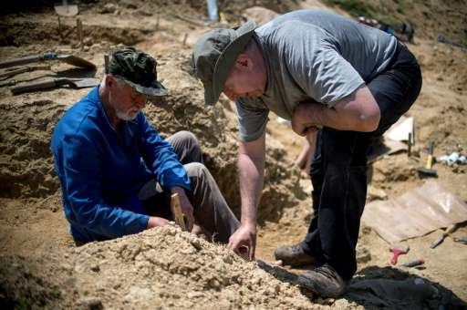 Professor Nikolay Spassov (R) works on a dig in Bulgaria where he hopes to find more skeletal remains to support his controversi