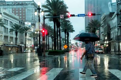 Rain from the remnants of Hurricane Harvey falls in New Orleans, where people with vivid memories of Hurricane Katrina in 2005 a