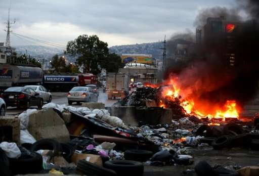 Smoke billows from a burning garbage dump on the northern entrance to the Lebanese capital, Beirut, on October 26, 2015