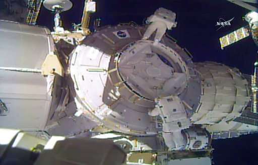 Spacewalkers lose piece of shielding, use patch instead