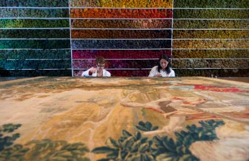 Specialists work at the Royal Manufacturers De Wit in Belgium currently the world's biggest restorer of old tapestries