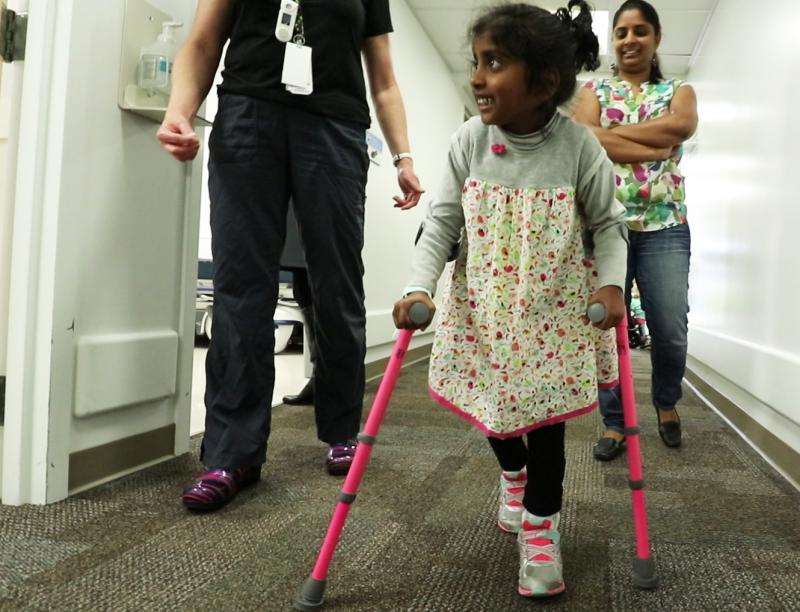 Spine surgery helps girl with cerebral palsy walk