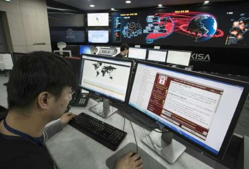 Staff monitor the spread of ransomware cyber-attacks at the Korea Internet and Security Agency in Seoul