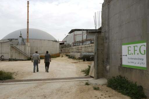 Storage silos at Jebrini dairy farm in the West Bank town of Hebron, where cow dung is used to produce electricity as an alterna