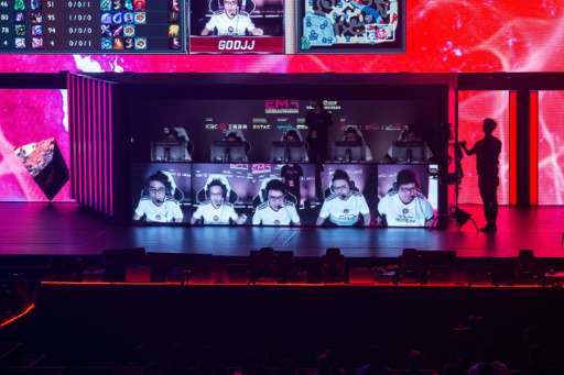 Team Hong Kong, Taiwan and Macau (C) play on stage in the League of Legends gaming tournament during the eSports and Music Festi