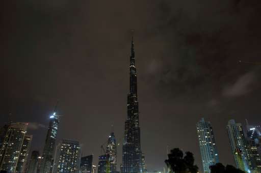 The lights on the Burj Khalifa tower, the world's tallest building, are switched off for an hour in Dubai