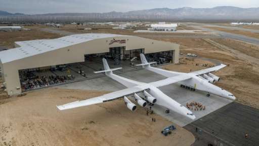 The Stratolaunch plane is pushed out of the hanger for the first time in the Mojave desert, California on May 31, 2017