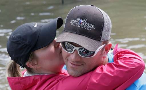 This evacuee kissed and hugged a volunteer who helped her family escape flood waters in Lakeside Estate in Houston