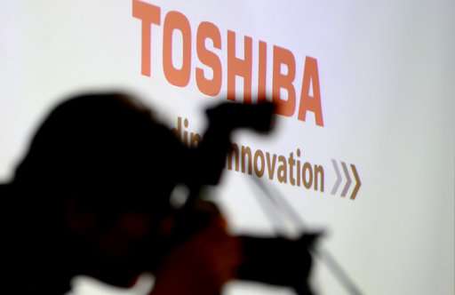 Troubled Toshiba, Bain finalize sale of memory-chip business