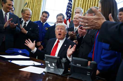 Trump signs NASA bill, ponders sending Congress to space (Update 3)