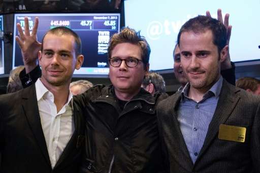 Twitter co-founder Biz Stone, at center in 2013 photo at the New York Stock Exchange debut of the social network, is flanked by 