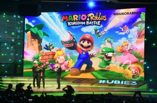Ubisoft CEO Yves Guillemot (R) and game designer and producer Shigeru Miyamoto (C) introduce &quot;Mario + Rabbits, Kingdom Batt