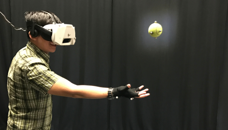 Using virtual reality to catch a real ball