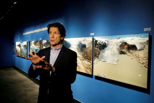 US photographer James Balog speaks about his images at the &quot;Extreme Ice&quot; exhibit at the Museum of Science and Industry