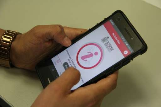 View of a new app released by Juarez's city hall to help women in distress send alert signals by simply shaking the phone or pre
