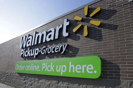 Wal-Mart's online sales surge, tops 1Q expectations