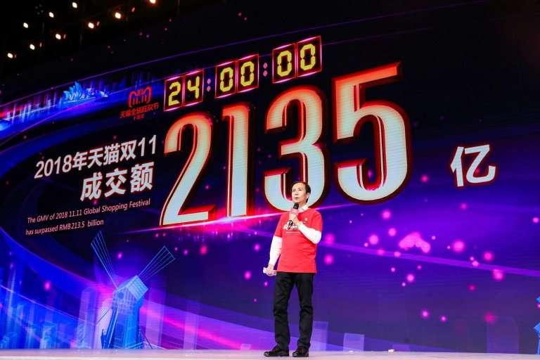 Alibaba CEO Daniel Zhang speaks in front of a screen showing total sales at over 213.5 billion yuan (30.7 billion USD) shortly a