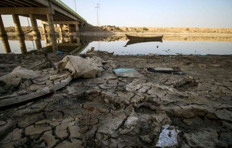 A picture taken on March 20, 2018 shows a view of the dried-up shore of an irrigation canal near the village of Sayyed Dakhil, s