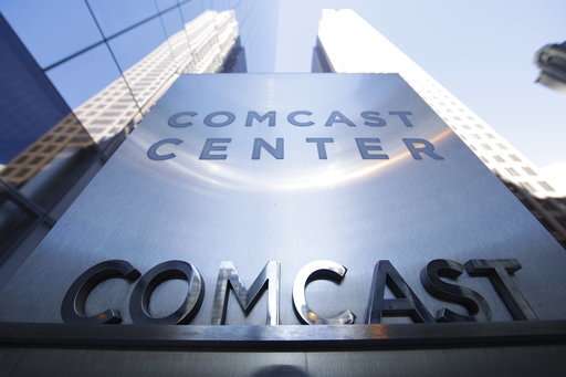 Comcast drops Fox bid, paving way for sale to Disney