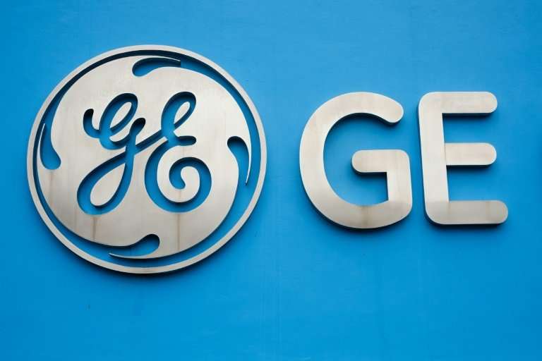 General Electric reported a $9.8 billion fourth-quarter loss due to hefty charges linked to its insurance business and US tax re