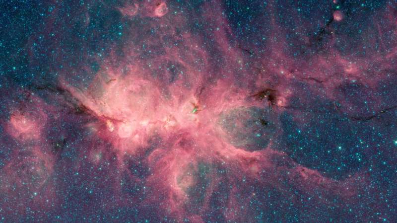Image: Newborn stars blow bubbles in the Cat's Paw Nebula