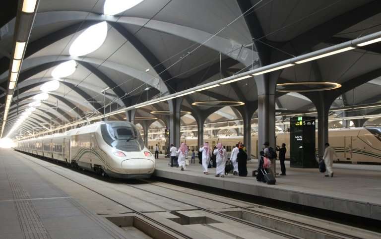 Passengers walk on the platform at Mecca train station on October 11, 2018 as Saudi Arabia's new high-speed railway opens
