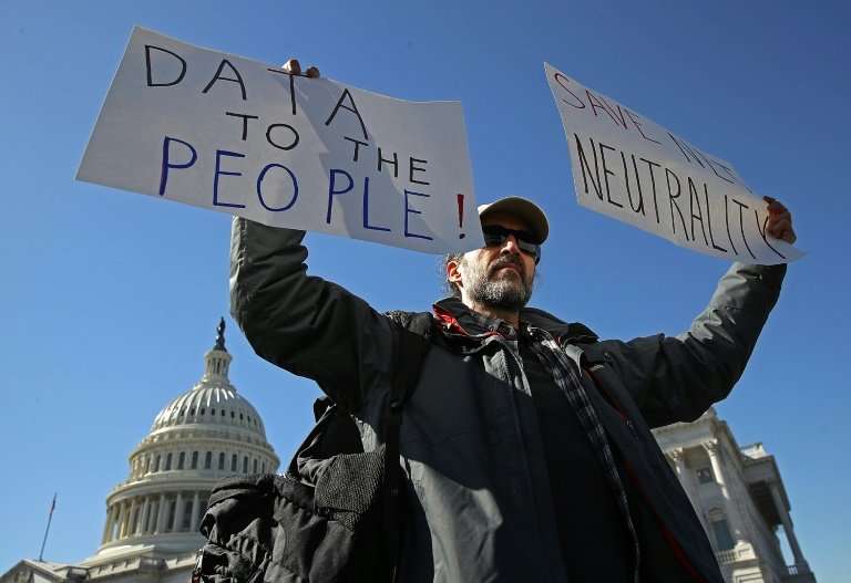 Protesters in Washington on February 27 urged lawmakers to reverse regulators and restore &quot;net neutrality&quot; rules that 