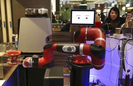 Robot makes coffee at new cafe in Japan's capital