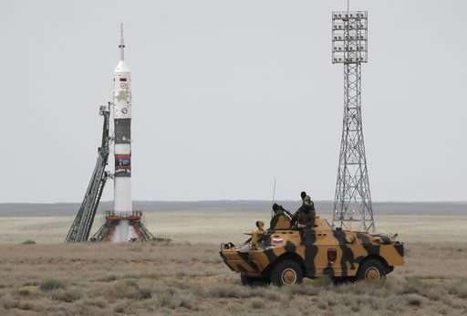 Soyuz capsule with 3 astronauts docks with space station