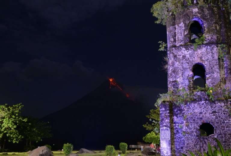 This photo taken on January 28, 2018 shows Mayon volcano spewing lava ash from its crater, as seen in Daraga town, south of Mani