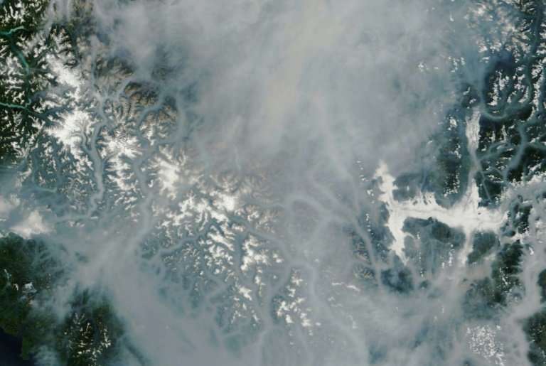 This satellite image released August 13, 2018 shows the smoky landcape of British Columbia province in southwestern Canada