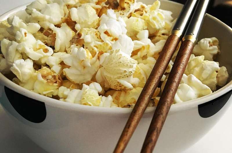 Why you should eat popcorn with chopsticks – and other psychological tricks to make life more enjoyable