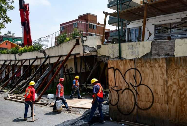Workers preprare to demolish Enrique Rebsamen elementary school in Mexico city, on August 20, 2018. The school collapsed during 
