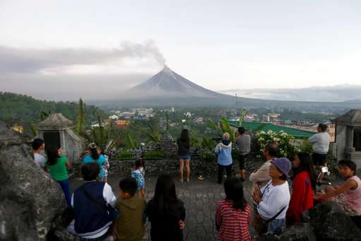Philippine volcano spews lava fountains, 56,000 people flee