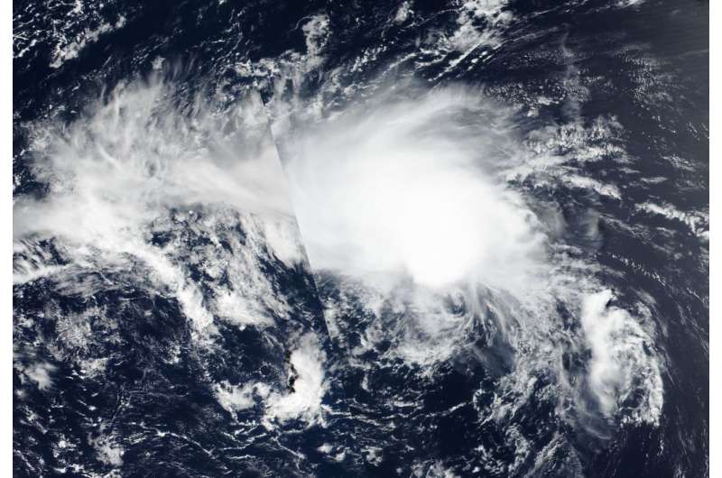 NASA satellite image Tropical Depression Hector elongating, weakening