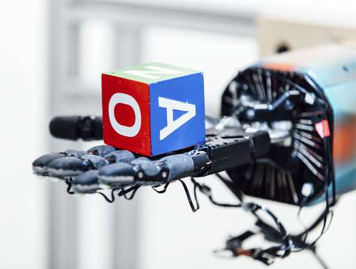 A robotic hand can juggle a cube -- with lots of training