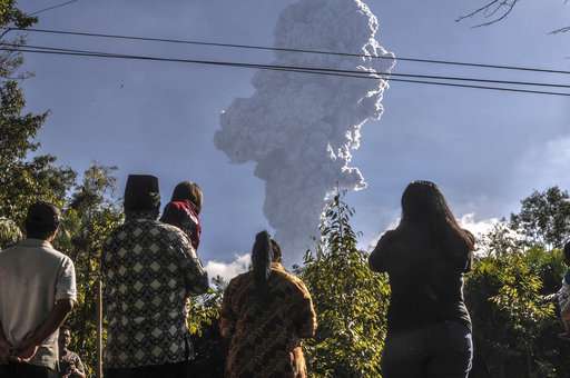 Indonesia's Merapi volcano ejects towering column of ash