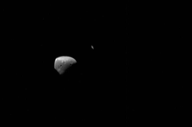 Mars Express views moons set against Saturn's rings