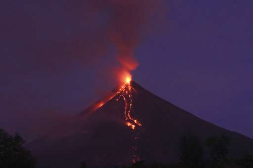 Significant ash falls near erupting Philippine volcano