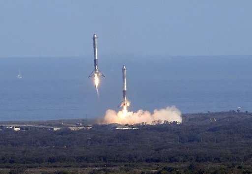 SpaceX's big new rocket blasts off, puts sports car in space