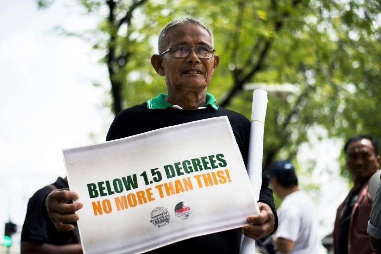 Environmental activists have protested outside Bangkok's UN building to call for more accountability on climate change
